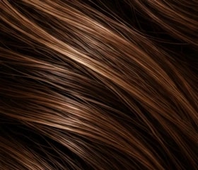 Close-up of flowing brunette hair with light and dark dimension